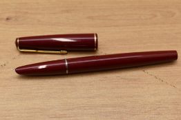 A Parker 17 aerometric fill fountain pen in red with gold trim. Needs bladder