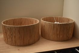 A pair of natural raffia ceiling lamp shades 40cm diameter x 20cm depth.