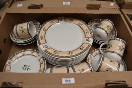 A Stoneware 'Tuscan Olive' part dinner service including dinner and side plates, dessert dishes