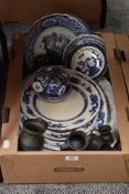 A selection of blue and white ware including platters and plates, four vintage pewter tankards and