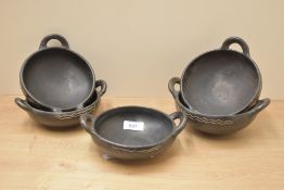 Five Hellenistic style wooden bowls of varying sizes, the largest having a diameter of 14cm