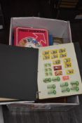 An assorted collection of World stamps and albums