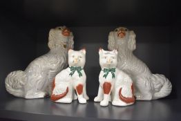 A pair of Staffordshire Pottery spaniels of traditional design 32cm, crazing and staining, sold