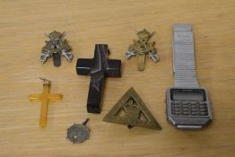 A small collection of jewellery and badges, including two agate cross pendants, an Odyssey