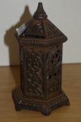 A Victorian cast-iron Oriental Pagoda design money bank, decorated with birds and foliage, the