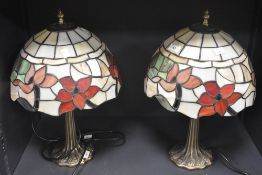 A pair of modern attractive Tiffany style electric table lamps, with decorative leaded glass