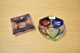 Two mid-20th Century art glass tricoloured ashtrays, measuring 15cm and 12cm in diameter