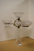An Edwardian gilt metal and cut glass three branch table centre piece.