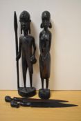 A pair of African tribal carved warrior studies, each measuring 36cm high, and a pair of hardwood