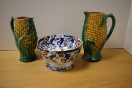 Two 19th Century Majolica sweetcorn jugs, both having lozenge marks to the underside, the largest