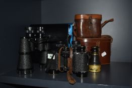 Three pairs of binoculars. A pair of Ross od London brass and leather binoculars inscribed EE O