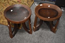 A pair of 20th Century Ethiopian hardwood stools from the Gorague tribe, each measuring 40cm high,