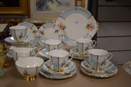 An Imperial part tea service having blue and white segmented edged design with floral inserts,