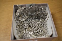 An assortment of costume large statement pendants or charms, including treble clef, christmas