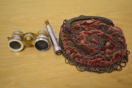 A pair of unusual lilac enamelled gilt metal opera glasses, with detachable and adjustable handle,