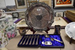 A silver plated salva having vine leaf to design to edge and three feet, a cased set of Owen