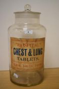 A large early 20th century glass 'Hospital Chest & Lung Tablets' jar and cover, retaining the