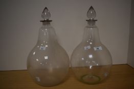 A pair of Victorian Chemists/Apothocary window display Carboy bottles, each with pointed stopper