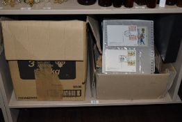 2 boxes with 10 or so albums of PHQ cards dating 1980s to around 200. Mix of used and unused within.