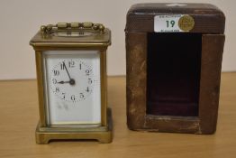 An early 20th century brass five-glass carriage timepiece, of traditional design with oval