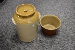 A large buff glazed Stoneware lidded crock stamped 10qts sold alongside a similar crock pot.