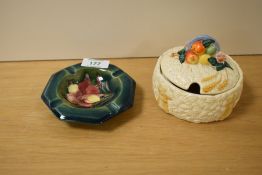 A Moorcroft Freesia ashtray sold alongside a Clarice Cliff preserve jar.