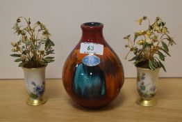 A Poole Pottery Volcano pattern vase, of globular form with short raised neck, applied label to body