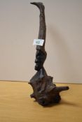 A 20th Century African figural root carving, measuring 27cm high
