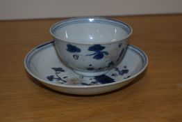 An 18th century Chinese porcelain 'Nanking Cargo' tea bowl and saucer dish, decorated with foliate