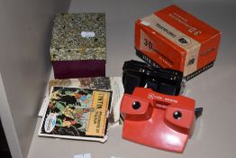 Four Viewmaster slide viewers and a selection of slides
