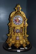 An impressive 19th century French gilt metal mantel clock, profusely decorated throughout with