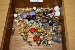 A selection of clip on earrings, including enamelled examples, paste set examples, hoops and some