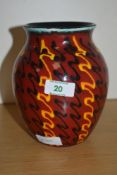 An attractive Poole Pottery 'Strobe' pattern baluster vase, decorated in bands of black and yellow