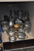 A collection of silver plate and Pewter ware including four tankards, a large tray and three part