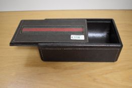A Mens Gucci stitched leather jewellery or watch box, with green and red band to top, sliding lid