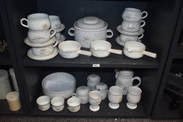 A collection of Denby stoneware, having pale grey ground with pink and pale green floral pattern,