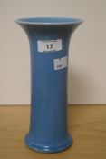 A 1920's Ruskin Pottery blue crystalline glazed vase, of flared cylindrical form, impressed marks to
