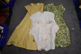 A late 1940s multi coloured floral day dress, having V neckline and gathered skirt and bust, sold