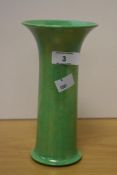 An early 20th century Ruskin Pottery vase, of flared cylindrical form with lustrous mottled green
