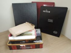 GB AND WORLD STAMPS IN ALBUMS, ALONG WITH CLIPPINGS IN TINS ETC Box with well filled world