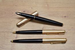 A Parker 61 capillary fill fountain pen, ballpoint pen and propelling pencil set in black with