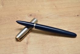 A Parker 51 aerometric fill fountain pen in cedar blue with a lustraloy cap having gilt trim diamond