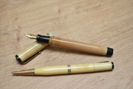 A Mabie Todd & Co Swan lady twist fill fountain pen and propelling pencil set in onyx with two
