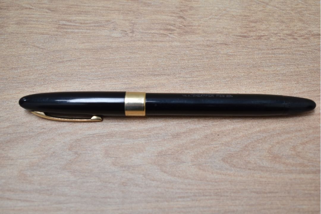 A Sheaffer Statesman snorkel fill fountain pen in black with broad band to white spot cap having - Image 3 of 3
