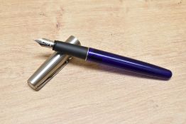A Parker Frontier cartridge fountain pen in translucent blue with stainless steel cap and Parker