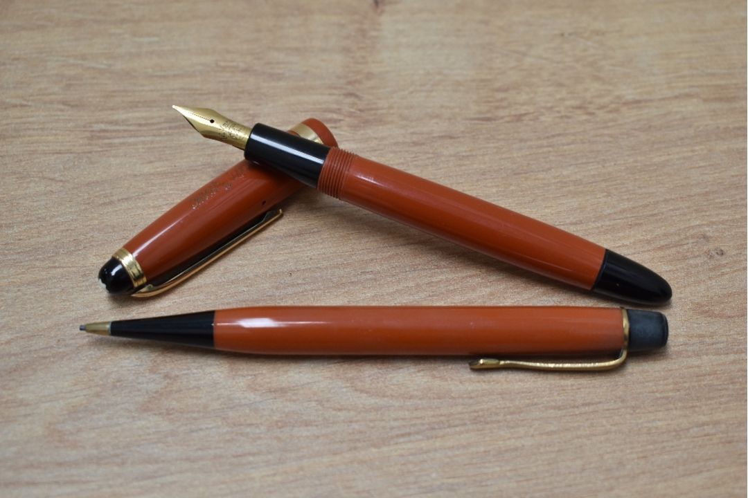 A rare Montblanc 214 button fill fountain pen and propelling pencil in coral red made in Denmark - Image 1 of 3