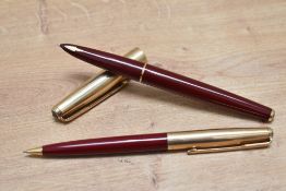 A Parker 61 Custom capillary fill fountain pen, and propelling pencil set in burgundy with rolled