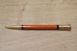 An early Parker Duofold ring top propelling pencil in orange