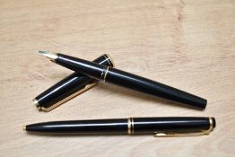 A Montblanc 221 converter fill fountain pen and ballpoint pen in black with gold trim