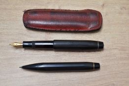 A Kaweco Sports twist fill fountain pen in black and propelling set in leather pouch, pen having